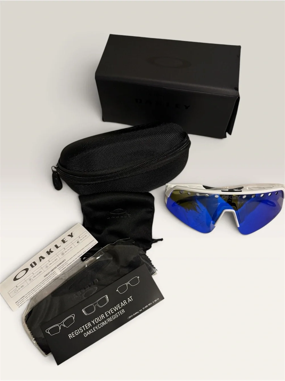 Oakley White Frame Sports Sunglasses with Blue Mirror Lenses
